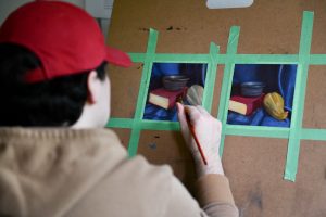WSU Tri-Cities digital technology and culture student Kyle Kopta paints from home as part of a fine arts course amid the COVID-19 pandemic