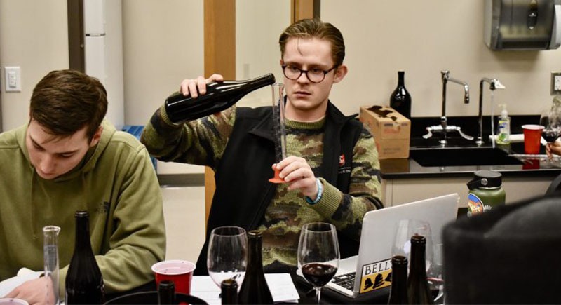 Andrew Gerow testing wine in his Blended Learning class at WSU.