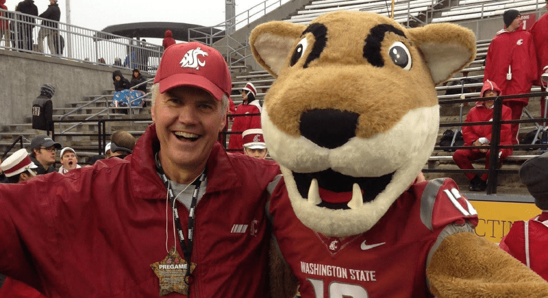 WSU alumnus Brad Fisher and Butch T. Cougar at a WSU football game