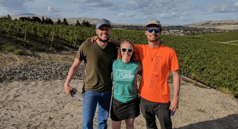WSU students Zachary Green, Madelyn Calderon, and Justin Archibald after harvesting grapes in Kiona, Wash.