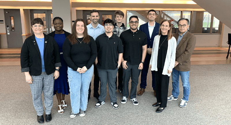 A group of students and WSU leadership.