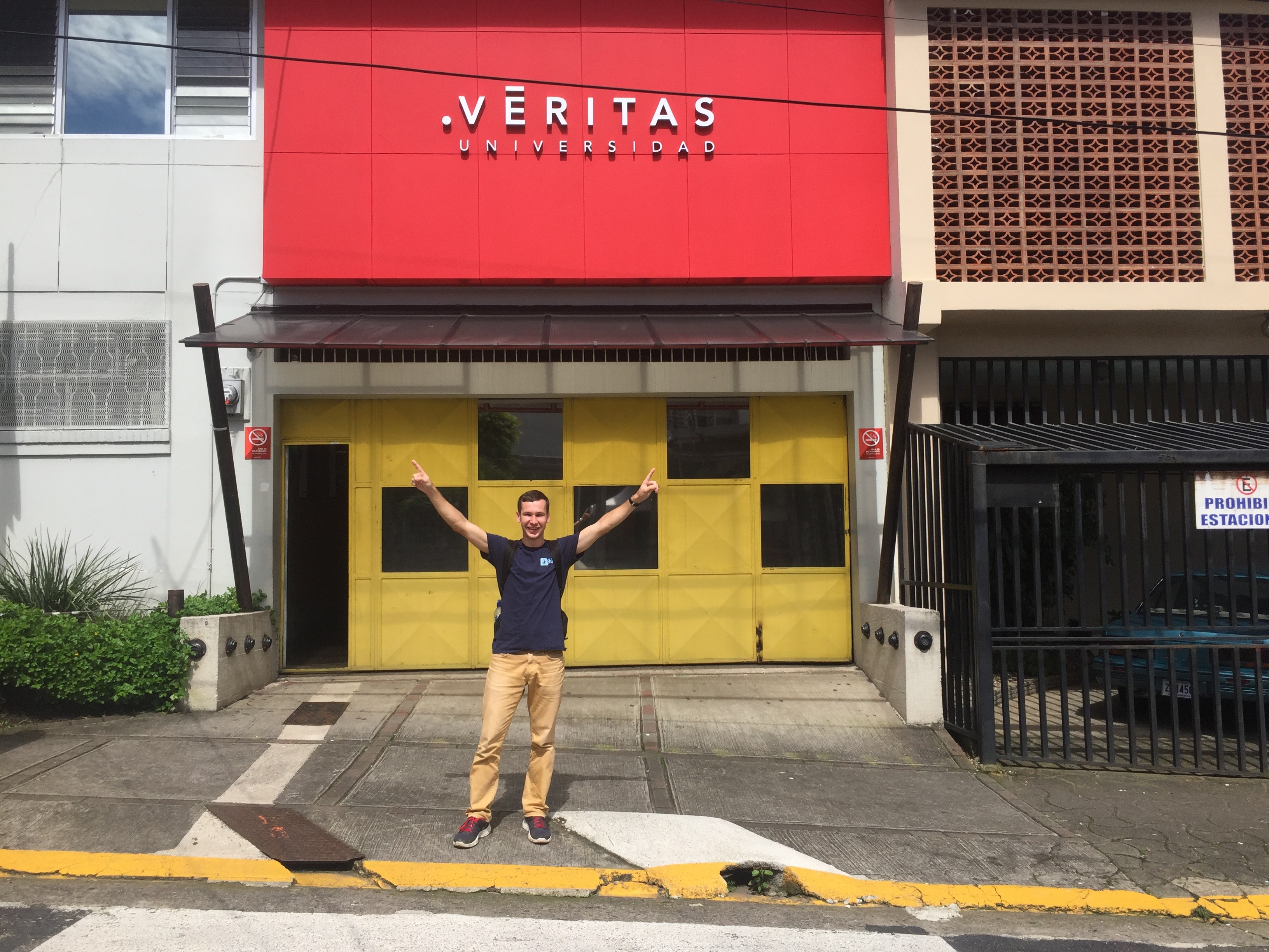 Nikita poses in front of his university in Costa Rica