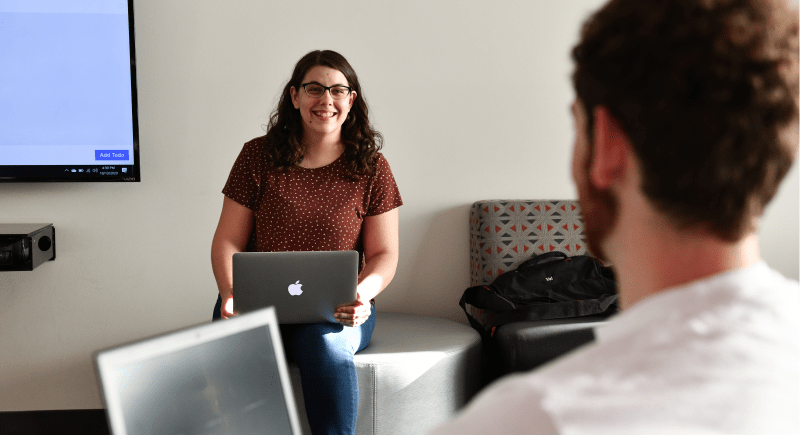 WSU Tri-Cities computer science student KJ Galvan chats with a fellow student