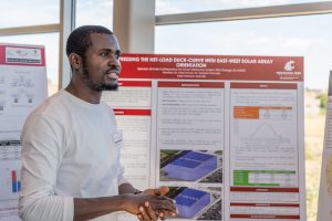 Student researcher presenting a poster in the Wine Science Center.