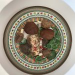 Sculpted food items on a plate.