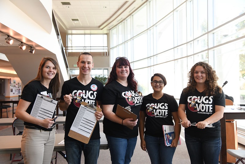 Group of students wearing shirts that say "Cougs Vote".